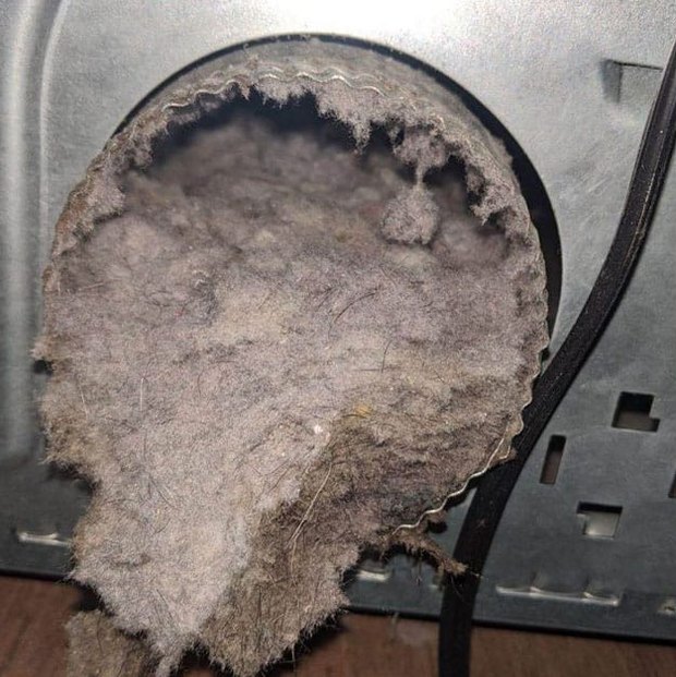 Dryer vent before cleaning — packed with lint, restricting airflow